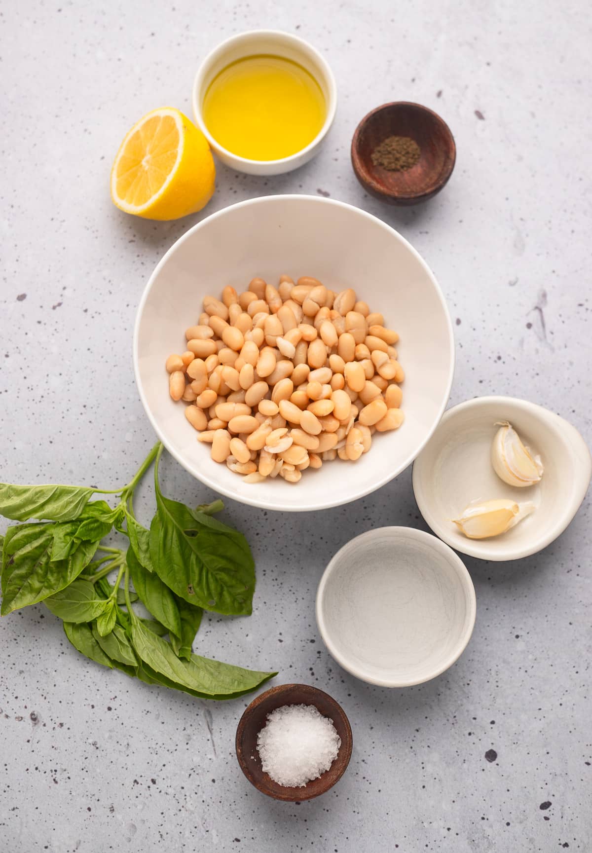 Ingredients for white dive into individual white bowls.