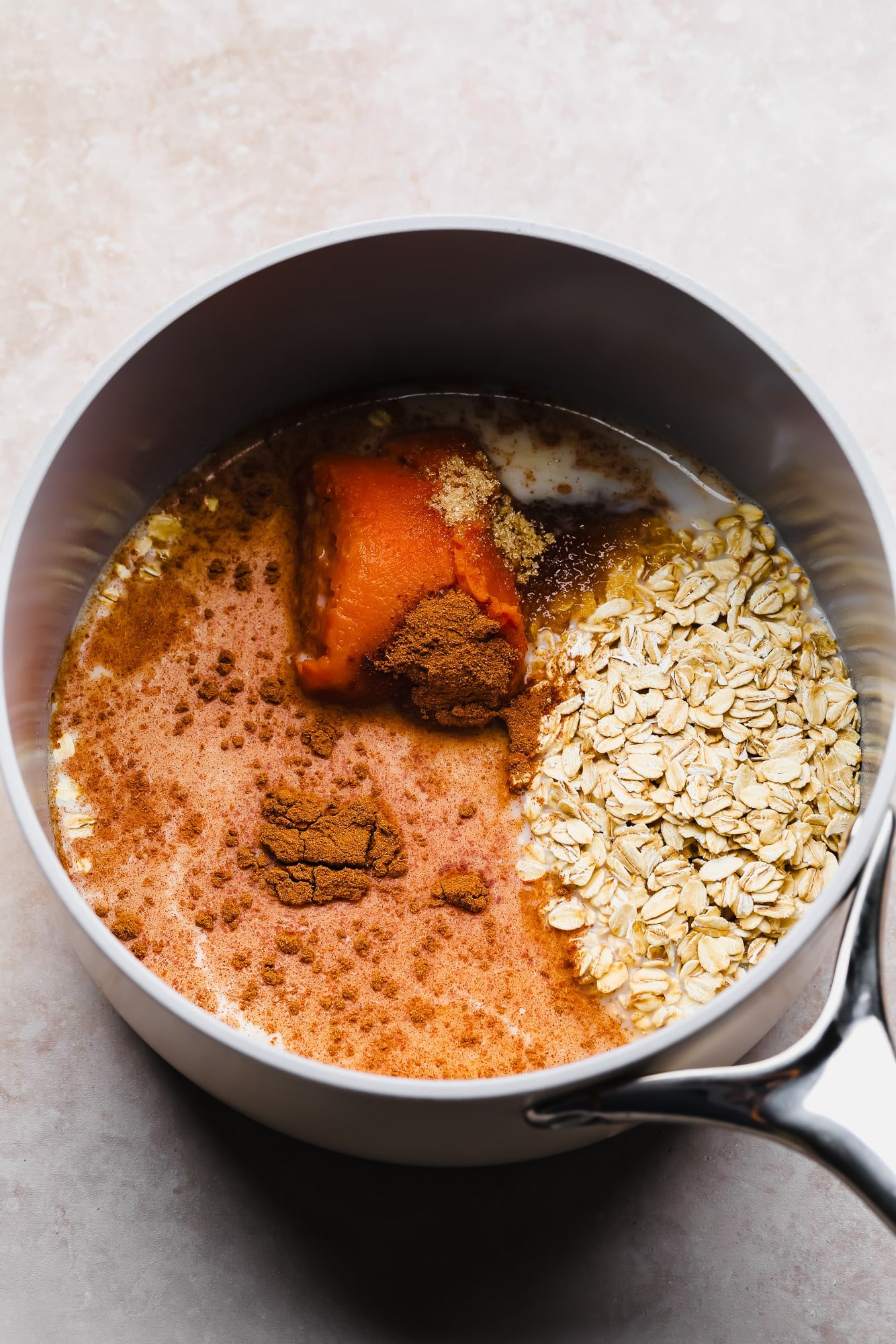 The ingredients for pumpkin oats in a pot.