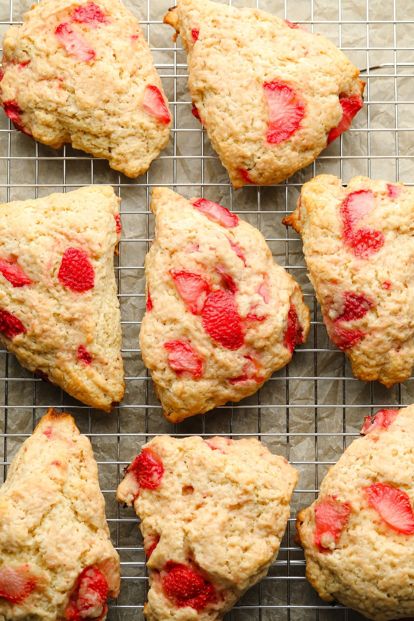 Vegan strawberry scones in a wire frame.