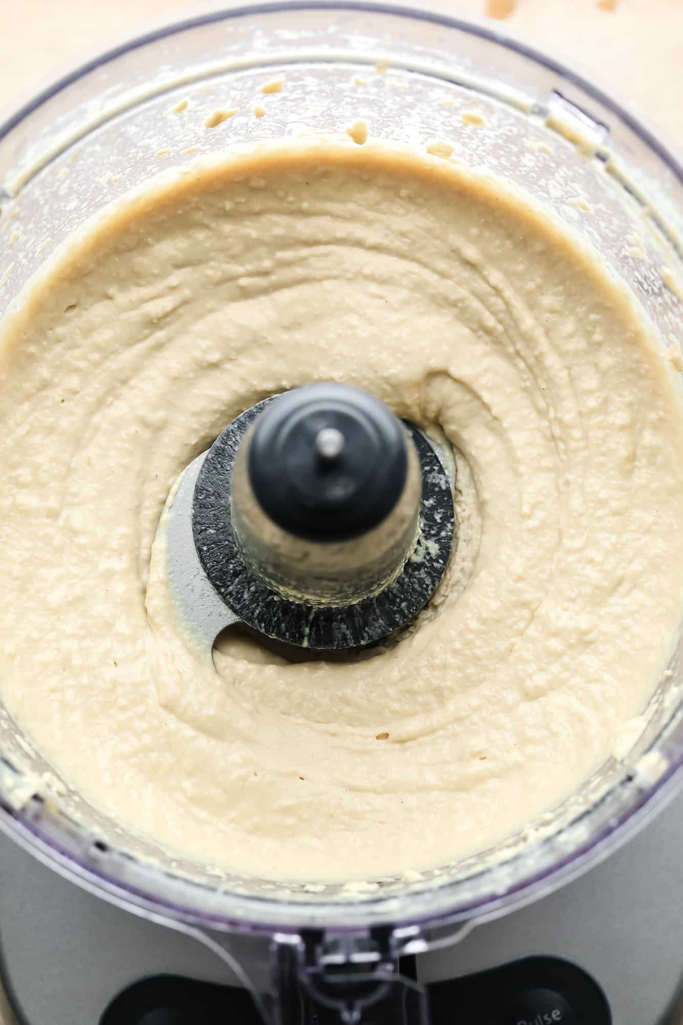 Hummus mixed in a food processor.