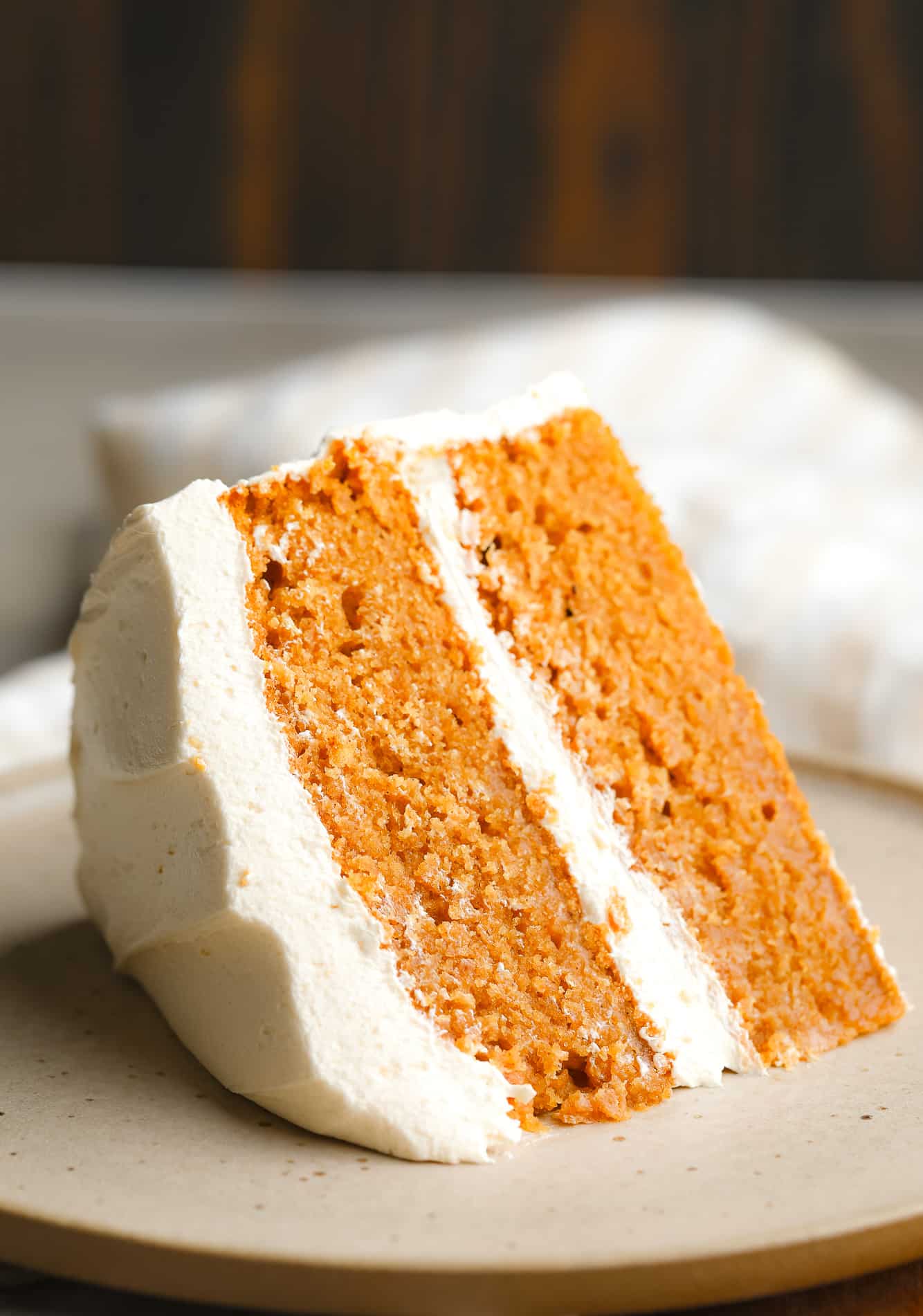 Near a slice of pumpkin spice cake.
